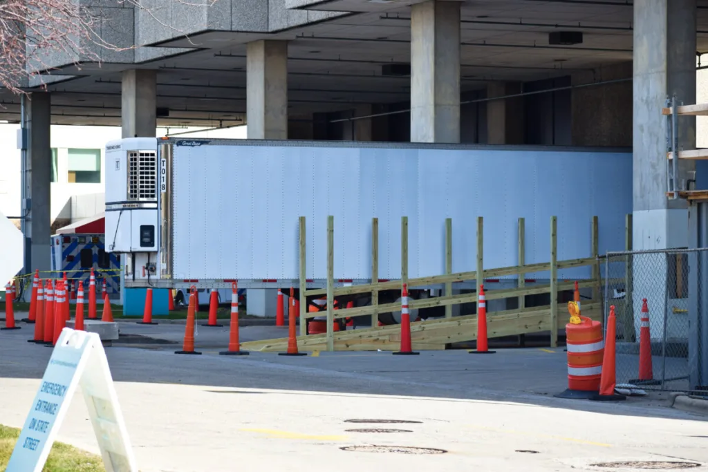 In this April 2020 photo, a refrigerated truck sits outside Aurora Sinai hospital in Milwaukee as a temporary morgue in the early weeks of the coronavirus outbreak.