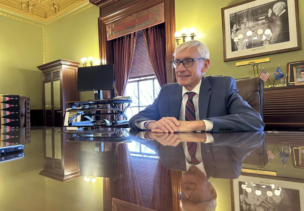 Gov. Tony Evers at his desk