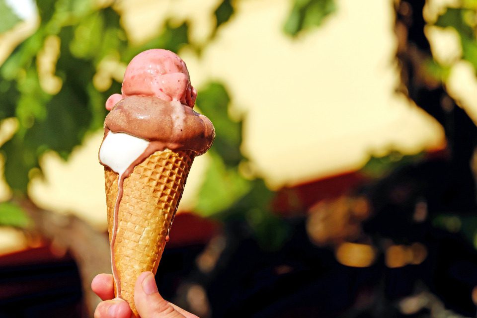 An ice cream cone partially melted.